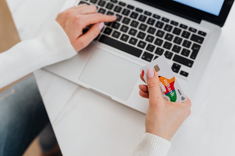 CC Flow Line of Credit online application shown with laptop and bank card